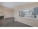 Open-concept space with a fireplace and a view of the breakfast bar that connects to the kitchen at 6250 W Flamingo Rd # 51, Las Vegas, NV 89103