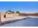 The backyard includes a storage shed, perimeter block fencing, and desert landscaping at 626 Taliput Palm Pl, Henderson, NV 89011