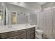 This bathroom offers double sinks, a shower/tub combination, and a neutral color scheme at 626 Taliput Palm Pl, Henderson, NV 89011