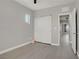Bedroom featuring a double-door closet and light wood flooring at 626 Taliput Palm Pl, Henderson, NV 89011