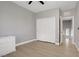 Bedroom featuring a double-door closet and light wood flooring at 626 Taliput Palm Pl, Henderson, NV 89011