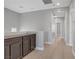 Upstairs hallway featuring hardwood floors, built-in cabinets, and access to multiple rooms at 626 Taliput Palm Pl, Henderson, NV 89011