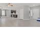 Spacious open living space with hardwood floors leading to kitchen and featuring light gray walls and white trim at 626 Taliput Palm Pl, Henderson, NV 89011