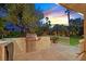 Backyard featuring an outdoor kitchen with a grill, sink and counter space, perfect for outdoor entertaining at 6345 Cinnabar Ridge Ave, Las Vegas, NV 89130