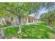 Lush backyard with mature landscaping and covered patio view at 6345 Cinnabar Ridge Ave, Las Vegas, NV 89130