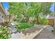 Lush backyard with mature landscaping and patio at 6345 Cinnabar Ridge Ave, Las Vegas, NV 89130
