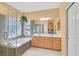 Luxurious bathroom with a soaking tub, a walk-in shower and a double sink vanity at 6345 Cinnabar Ridge Ave, Las Vegas, NV 89130