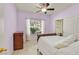 Bedroom with a queen bed, and a window showcasing outdoor greenery at 6345 Cinnabar Ridge Ave, Las Vegas, NV 89130