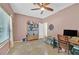 Bedroom with ceiling fan, window, and light neutral walls at 6345 Cinnabar Ridge Ave, Las Vegas, NV 89130
