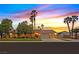 Beautiful single-story home featuring a well-manicured lawn, mature trees and a two-car garage at 6345 Cinnabar Ridge Ave, Las Vegas, NV 89130