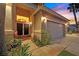 Home's inviting front entrance and well-lit walkway leads to the beautiful double-door entrance at 6345 Cinnabar Ridge Ave, Las Vegas, NV 89130