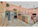 Well-lit kitchen featuring stainless steel appliances, lots of cabinetry and granite countertops at 6345 Cinnabar Ridge Ave, Las Vegas, NV 89130