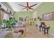 Open-concept living room with high ceilings, large windows, and tile flooring, perfect for entertaining at 6345 Cinnabar Ridge Ave, Las Vegas, NV 89130