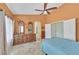 Spacious main bedroom featuring a ceiling fan, large windows, and a walk-in closet at 6345 Cinnabar Ridge Ave, Las Vegas, NV 89130