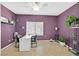 Home office featuring stylish lighting, a comfortable desk, and large potted plants at 6345 Cinnabar Ridge Ave, Las Vegas, NV 89130