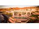 Stunning aerial view of the modern home with pool, spa, and mountain views at 661 Dragon Peak Dr, Henderson, NV 89012