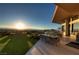 Backyard oasis with infinity pool, mountain view, outdoor seating, dining, and barbecue at 661 Dragon Peak Dr, Henderson, NV 89012