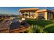 Beautiful backyard with comfortable patio furniture and manicured landscaping at 661 Dragon Peak Dr, Henderson, NV 89012