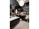 Chic bathroom with dark cabinetry, vessel sink and decorative wall accents at 661 Dragon Peak Dr, Henderson, NV 89012