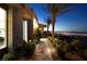 Modern home featuring landscaped walkway, stone facade, and city views at 661 Dragon Peak Dr, Henderson, NV 89012