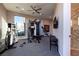 Spacious home gym equipped with modern fitness equipment and a wall-mounted TV at 661 Dragon Peak Dr, Henderson, NV 89012