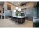 Contemporary kitchen features a large island, high-end appliances, and ample cabinet space at 661 Dragon Peak Dr, Henderson, NV 89012