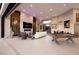 Open-concept living room with elegant decor, a fireplace, a pool table, and ample space at 661 Dragon Peak Dr, Henderson, NV 89012