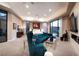 Spacious primary suite with modern design, fireplace, and access to a private outdoor space at 661 Dragon Peak Dr, Henderson, NV 89012