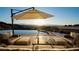 Relaxing outdoor lounge with comfortable seating, infinity pool, and breathtaking mountain views at 661 Dragon Peak Dr, Henderson, NV 89012