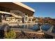 Luxurious outdoor area with an infinity pool and comfortable seating at 661 Dragon Peak Dr, Henderson, NV 89012