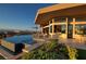 Luxury home featuring an infinity pool, spa, and outdoor lounge area with stunning views at 661 Dragon Peak Dr, Henderson, NV 89012