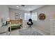 Bedroom features neutral carpet, soft grey walls, two windows, and minimal decor with plenty of room to grow at 7409 Central Butte Ave, Las Vegas, NV 89129