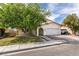 Well-maintained single-Gathering home with a two-car garage, desert landscaping, and a tidy front lawn at 7409 Central Butte Ave, Las Vegas, NV 89129