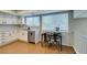 Functional kitchen design with breakfast nook, wood flooring, and ample sunlight at 7409 Central Butte Ave, Las Vegas, NV 89129