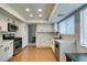 Updated kitchen features sleek stainless-steel appliances and classic white cabinetry at 7409 Central Butte Ave, Las Vegas, NV 89129