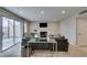 Comfortable living room with a fireplace, sliding doors to the backyard, and neutral décor at 7409 Central Butte Ave, Las Vegas, NV 89129