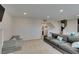 Spacious living area featuring a fireplace, plush seating, and neutral color palette at 7409 Central Butte Ave, Las Vegas, NV 89129