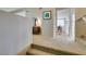Second-floor loft area with carpet, neutral paint, a dresser, and decor at 7409 Central Butte Ave, Las Vegas, NV 89129