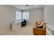 Office space with a large desk, comfortable chair, and a comfortable couch offering a bright and inviting atmosphere at 7409 Central Butte Ave, Las Vegas, NV 89129