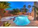 Inviting backyard features a pool, spa, and lush landscaping at 8204 Antler Pines Ct, Las Vegas, NV 89149