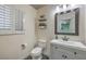 Clean bathroom with a new vanity and a mirror, offering a comfortable and functional space at 8204 Antler Pines Ct, Las Vegas, NV 89149