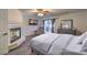 Cozy main bedroom featuring a fireplace, patio access, and dresser at 8204 Antler Pines Ct, Las Vegas, NV 89149