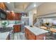 Spacious kitchen with island and breakfast table, adjacent to stairs and living area at 8204 Antler Pines Ct, Las Vegas, NV 89149