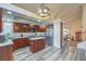 Modern kitchen with wooden cabinets, stainless steel appliances, and a central island at 8204 Antler Pines Ct, Las Vegas, NV 89149