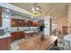 Contemporary kitchen with stainless appliances, island, and adjacent dining area at 8204 Antler Pines Ct, Las Vegas, NV 89149