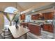 Modern kitchen with stainless steel appliances, island, and bright breakfast nook at 8204 Antler Pines Ct, Las Vegas, NV 89149