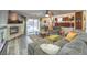 Cozy living room with a fireplace, large screen TV, and access to a backyard pool at 8204 Antler Pines Ct, Las Vegas, NV 89149
