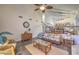 Bright, vaulted living room with wood-look floors and staircase at 8204 Antler Pines Ct, Las Vegas, NV 89149