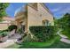 Exterior view of a beautiful home with a stone path and lush landscape at 8221 Crow Valley Ln, Las Vegas, NV 89113