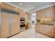 Well-equipped kitchen featuring stainless steel appliances, built-in oven, and seamless access to the dining room at 8221 Crow Valley Ln, Las Vegas, NV 89113